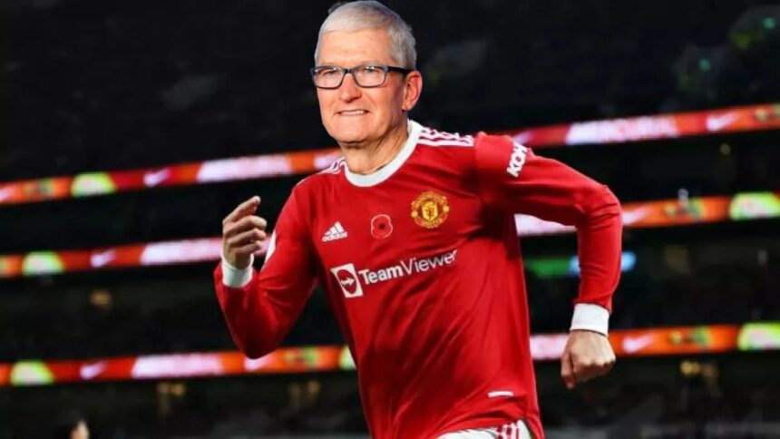 Tim Cook wearing a manchester united shirt